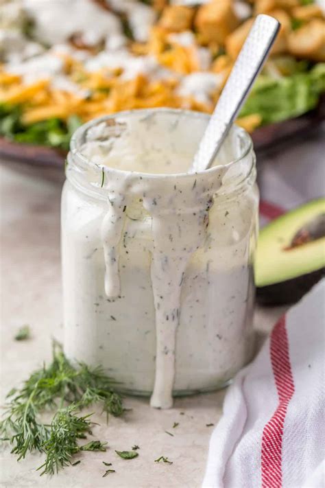 jar of ranch dressing in front of veggies