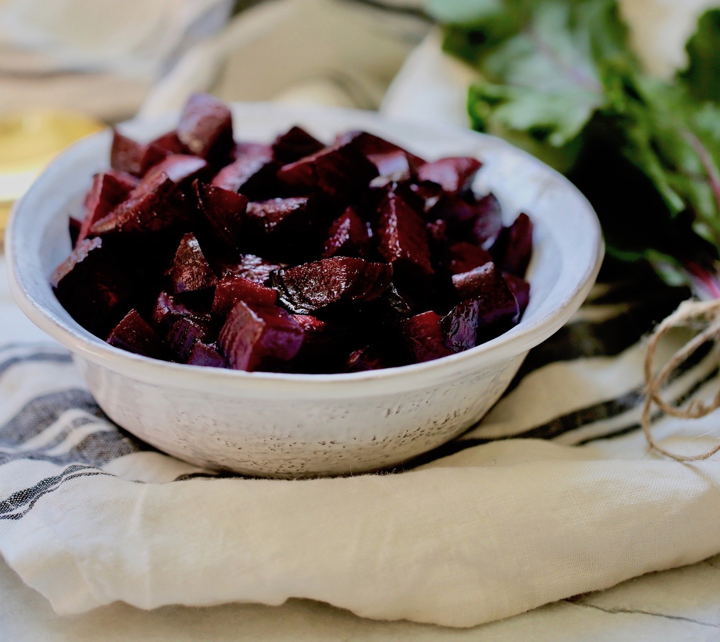white bowl full of purple beets