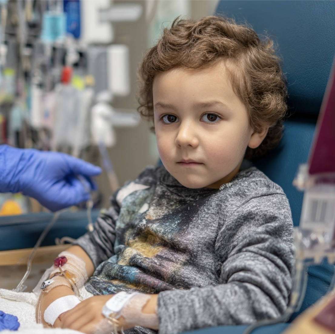 little boy in the hospital hooked up to IVs 